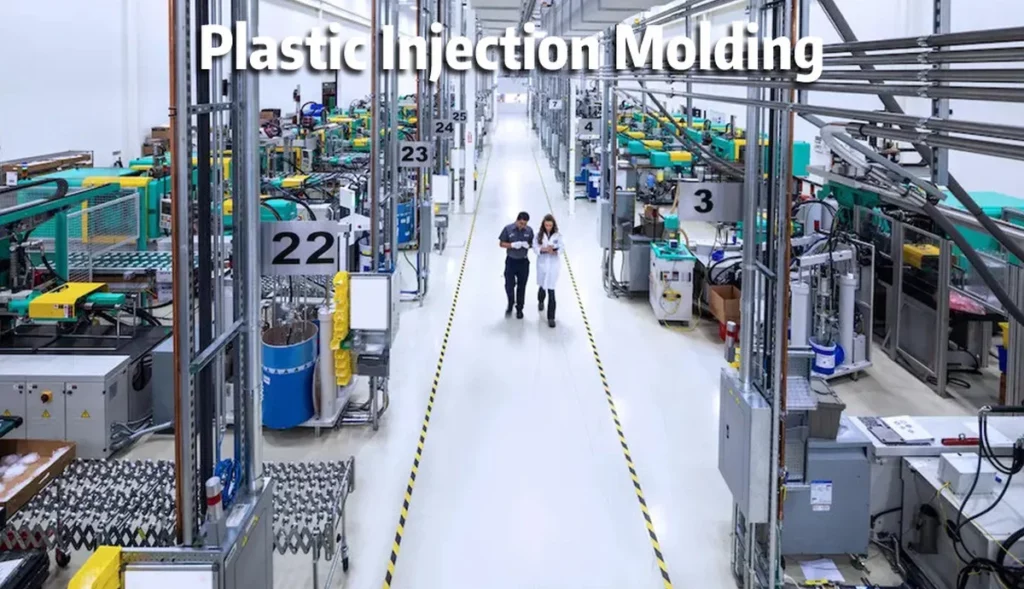 Auditors walking through an injection molding production floor during a supplier audit